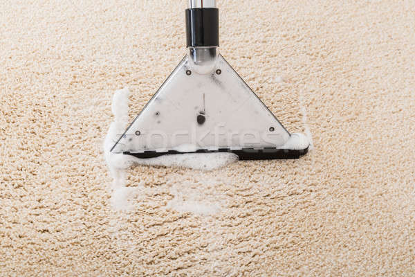 Aspirateur tapis mousse humide chambre [[stock_photo]] © AndreyPopov