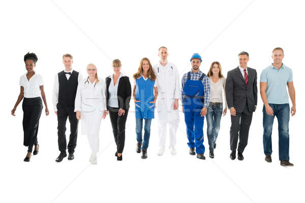 Confident People With Various Occupations Walking In Row Stock photo © AndreyPopov