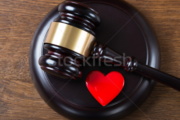 Mallet And Heart On Table In Courtroom Stock photo © AndreyPopov