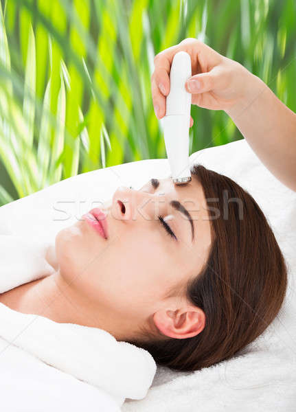 Woman Receiving Microdermabrasion Therapy On Forehead Stock photo © AndreyPopov