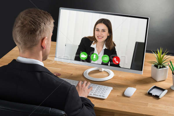 Businessman Video Conferencing On Computer Stock photo © AndreyPopov