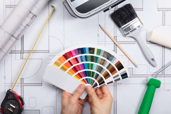 An Architect Holding Color Guide Swatch On Blueprints Stock photo © AndreyPopov