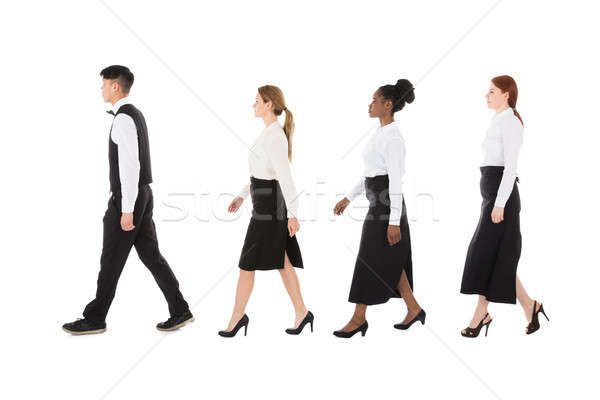 Young Restaurant Staff Walking In Row Stock photo © AndreyPopov