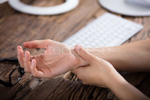 Businessperson Holding Painful Wrist Stock photo © AndreyPopov