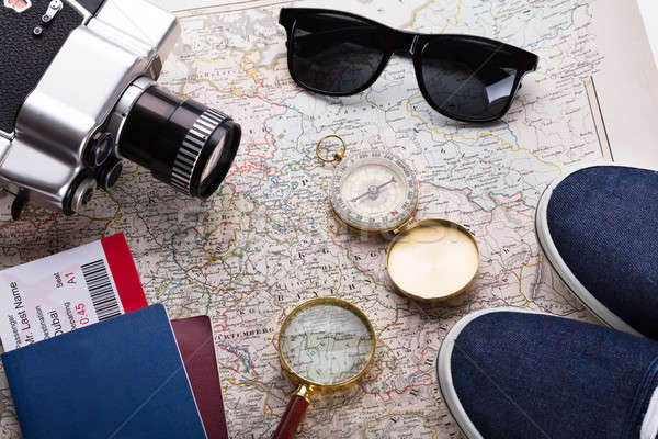 Stock photo: Boarding Pass Ticket, Passport And Camera On Map