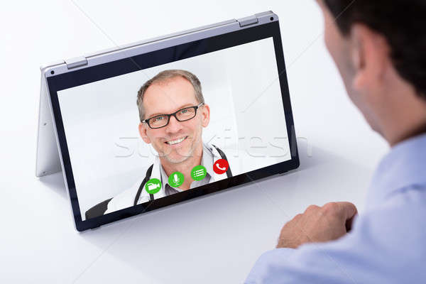 Férfi videó orvos hibrid laptop közelkép Stock fotó © AndreyPopov