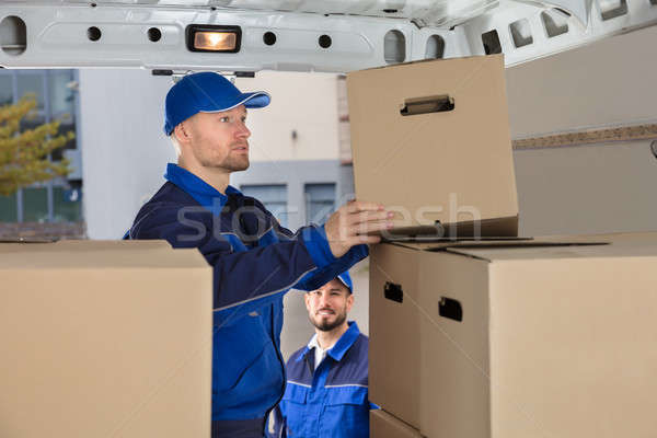 Mover Unloading Cardboard Box From Truck Stock photo © AndreyPopov
