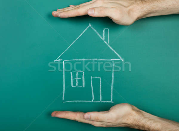 Drawing house on chalkboard Stock photo © AndreyPopov