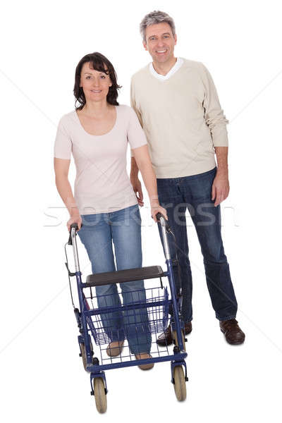 Mature couple using walking aide Stock photo © AndreyPopov