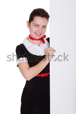 Beautiful flight attendant with paper airplane Stock photo © AndreyPopov