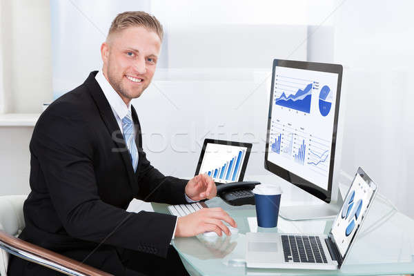 Stock photo: Businessman with good performance graph