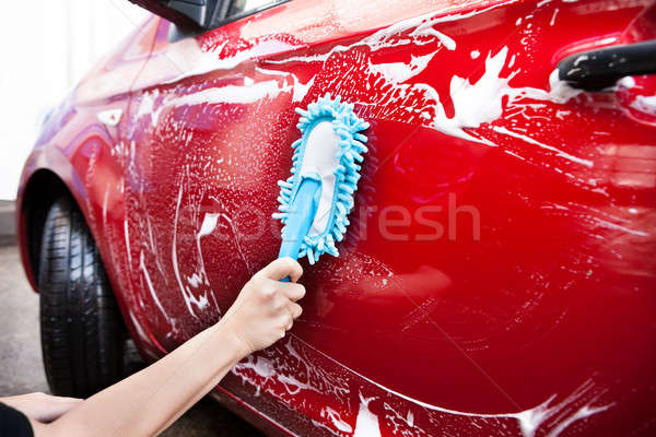 Hand Holding Brush Over Car Stock photo © AndreyPopov