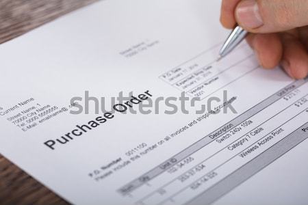 Hand With Pen And Eyeglasses Over Agreement Stock photo © AndreyPopov