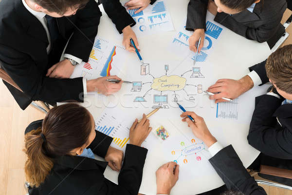 üzletemberek megbeszél felhő alapú technológia iroda üzlet papír Stock fotó © AndreyPopov