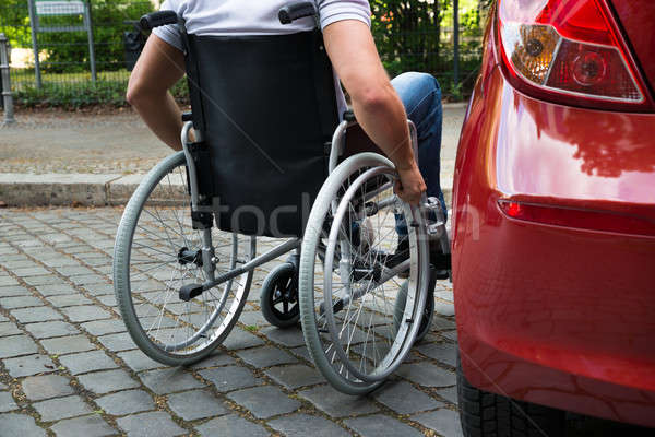 Disabled Man Sitting On A Wheelchair Near His Car Stock photo © AndreyPopov
