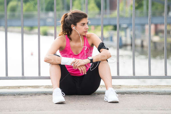 Contemplated Fitness Woman Listening To Music Stock photo © AndreyPopov