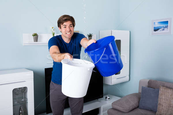 Stock photo: Man Holding Bucket