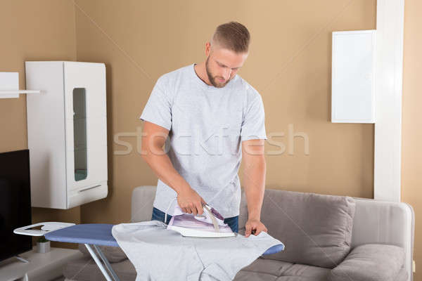Man Ironing Cloth Stock photo © AndreyPopov