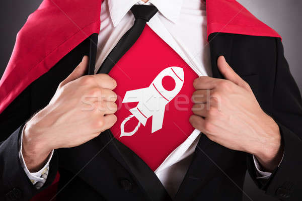 Businessman Opening Coat In Superhero Style Stock photo © AndreyPopov