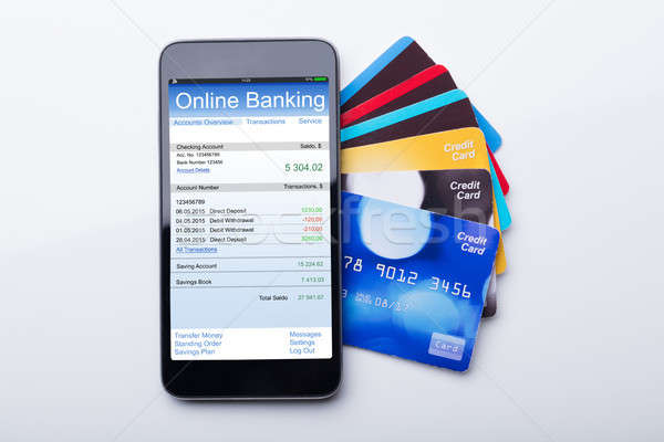 Mobilephone With Online Banking App And Credit Card Stock photo © AndreyPopov