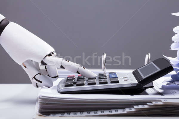 Robotic Hand Using Calculator In Office Stock photo © AndreyPopov