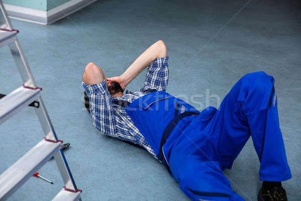 Sebesült ezermester padló zuhan munka otthon Stock fotó © AndreyPopov