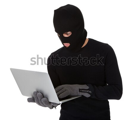 Burglar on Computer Stock photo © AndreyPopov