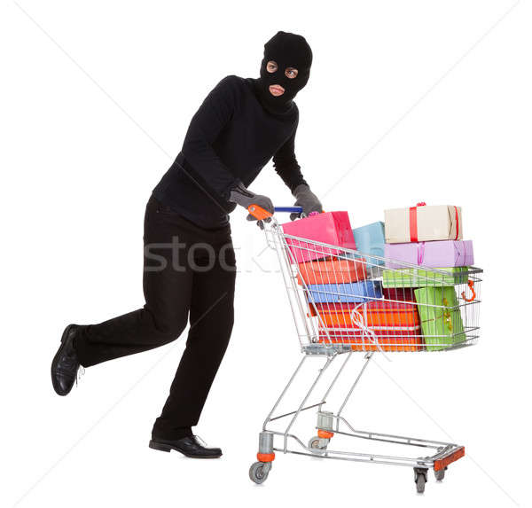 Thief pushing a trolley of gifts Stock photo © AndreyPopov