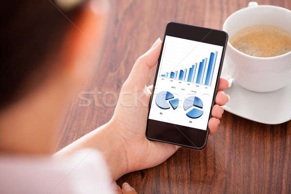 Woman Holding Mobile Phone Stock photo © AndreyPopov