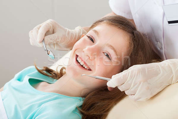 Happy Girl Undergoing Dental Treatment Stock photo © AndreyPopov