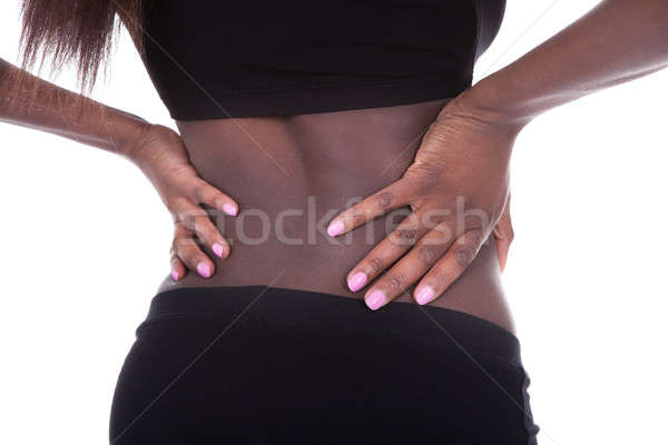 Woman In Undergarments Suffering From Backache Stock photo © AndreyPopov