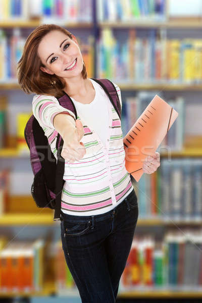 Stock photo: College Student Gesturing Thumbsup In Library