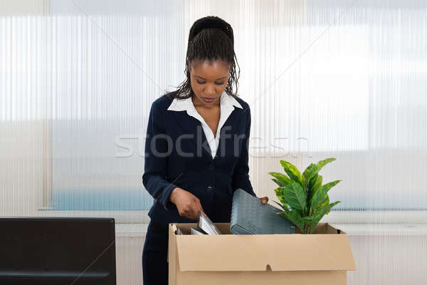 Businesswoman Carrying Box With Her Belongings Stock photo © AndreyPopov