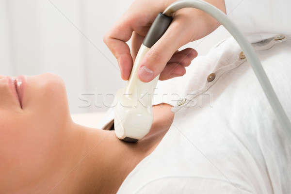 Woman Gets Ultrasound Of The Thyroid From Doctor Stock photo © AndreyPopov