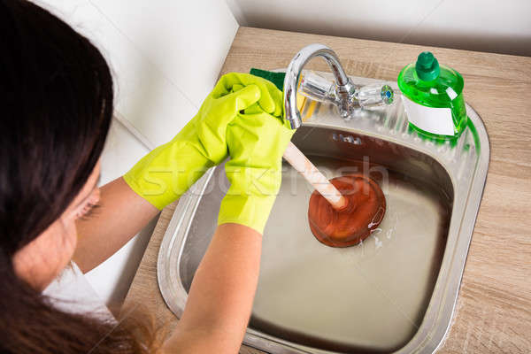 Person Using Plunger In The Sink Stock photo © AndreyPopov