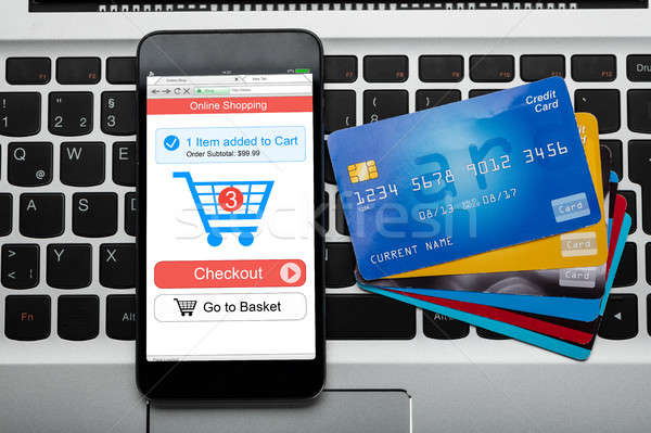 Mobilephone And Credit Cards On Laptop Keyboard Stock photo © AndreyPopov