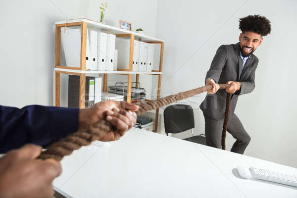 Two Businessmen Playing Tug Of War Stock photo © AndreyPopov