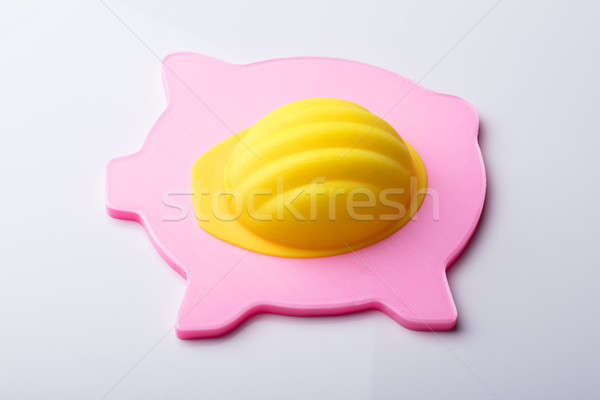 Yellow Hardhat Over Pink Piggybank Stock photo © AndreyPopov