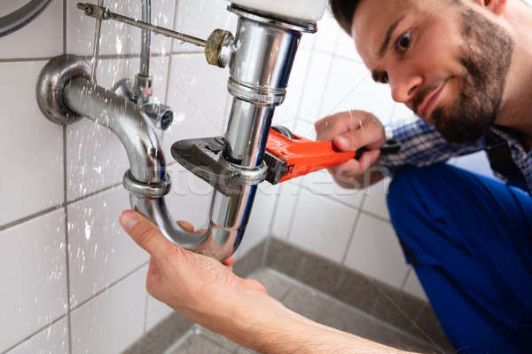 Plumber Repairing Sink Pipe Leakage Stock photo © AndreyPopov