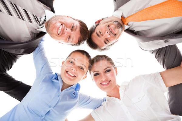 Boldog üzletemberek alulról fotózva kilátás készít üzlet Stock fotó © AndreyPopov