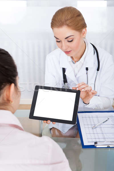 Doctor Showing Digital Tablet To Patient Stock photo © AndreyPopov