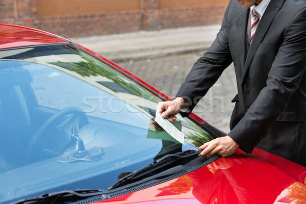 Man Holding A Parking Ticket Stock photo © AndreyPopov