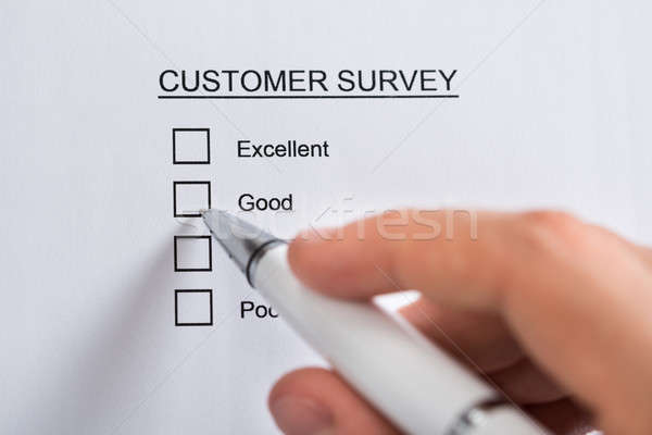 Person Hands Filling Customer Survey Form Stock photo © AndreyPopov