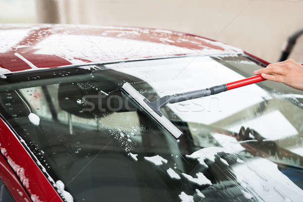 Worker Washing Windshield Of Car At Service Station Stock photo © AndreyPopov
