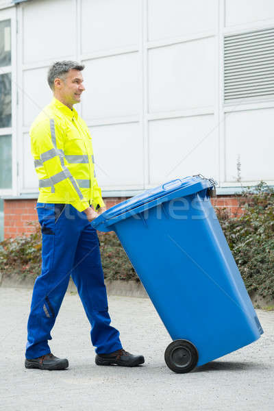 Male Worker Walking With Dustbin On Street Stock photo © AndreyPopov