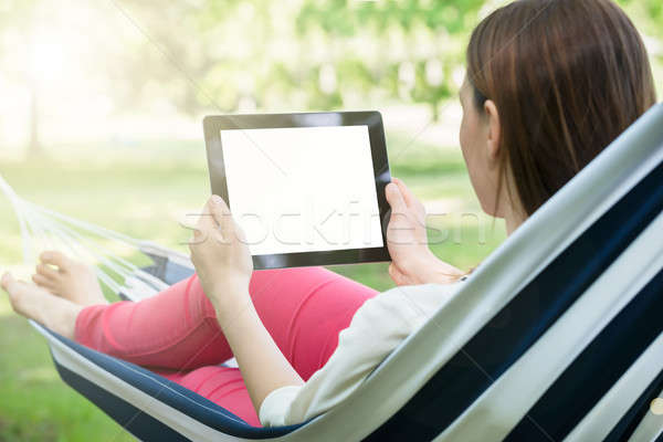 Woman Using Digital Tablet Stock photo © AndreyPopov