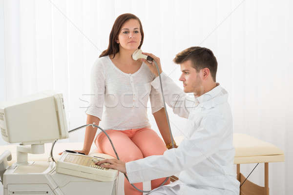 Woman Getting Ultrasound Of A Thyroid From Doctor Stock photo © AndreyPopov