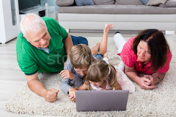 Multi Generation Family Using Laptop At Home Stock photo © AndreyPopov