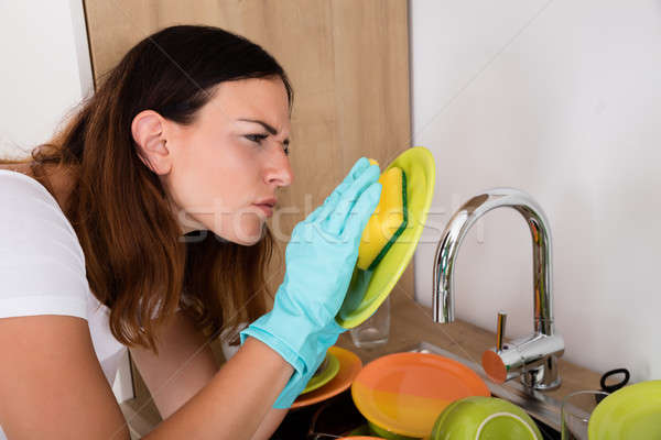 Woman Washing Plate Stock photo © AndreyPopov