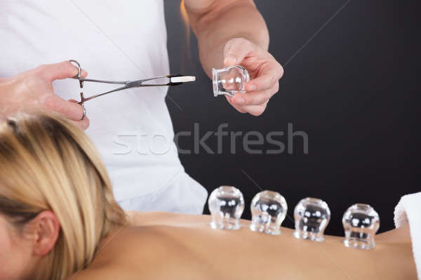 Woman Receiving Cupping Treatment On Back Stock photo © AndreyPopov